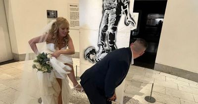 Glasgow newlyweds visit Banksy GoMA exhibition for unique wedding photoshoot