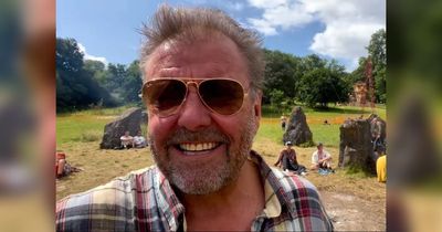 BBC's Martin Roberts turns 'hippie' as he arrives at Glastonbury