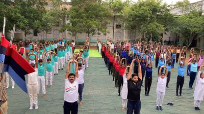 Youth throng playgrounds to perform asanas on International Yoga Day