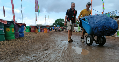 Glastonbury revellers soaked after heavy rain hits festival site