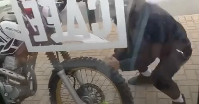 Moment brazen rock wielding thieves swipe motorbike in front of terrified Leeds Morrisons shoppers