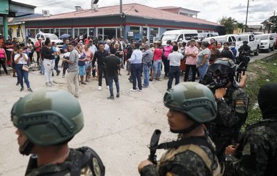 Several Honduras prison carnage victims were locked up and set on fire, officials say