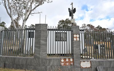 Russian digs in at building site after embassy decision