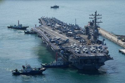 A US aircraft carrier will make a rare Vietnam port call as countries compete for favor in SE Asia