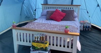 Man hailed a 'total legend' as he sets up double bed in his tent at Glastonbury