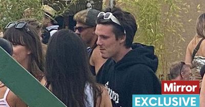 David Beckham's trainer keeps an eye on Cruz as the teenager parties at Glastonbury