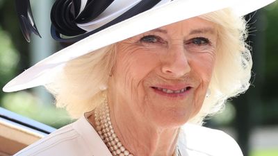Queen Camilla’s monochrome Ascot outfit is classically chic as she continues to snub favorite color