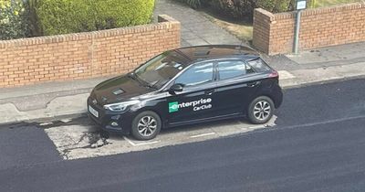 Council workmen resurface road around a parked car - leaving locals in stitches