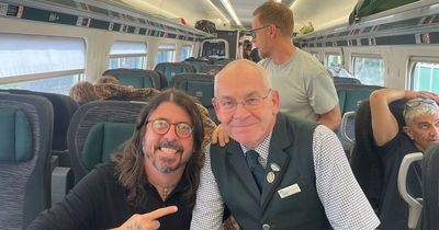 Dave Grohl turns heads as he catches train to Glastonbury for secret Foo Fighters set