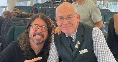 Foo Fighters' Dave Grohl pictured taking the train to Glastonbury ahead of surprise set