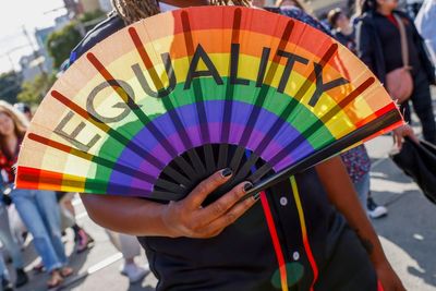 Party and protest mix as LGBTQ+ pride parades kick off from New York to San Francisco