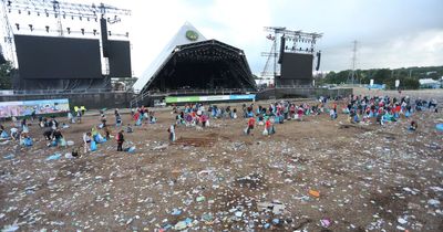 Glastonbury Festival-goers leave sea of rubbish in front of the Pyramid stage as huge clean-up begins