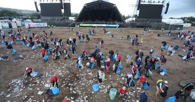 Glastonbury Festival-goers leave sea of rubbish in front of the Pyramid stage as huge clean-up begins