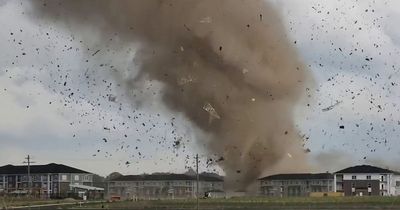 Moment tornado rips through homes as giant painful hail stones rain down on public