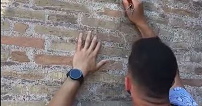Tourist sparks fury as he's filmed carving names into Rome's Colosseum