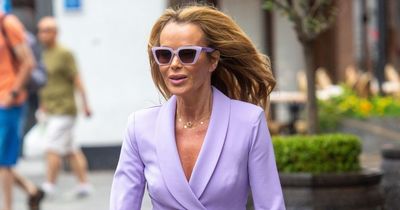 Amanda Holden gets caught by strong gust of wind as she dons mini dress to work