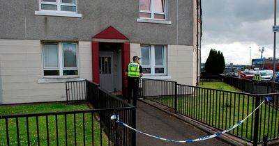 Glasgow road shut down by police after man found seriously injured in flat