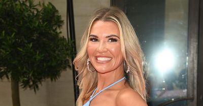 Christine McGuinness named 'ultimate bombshell' as she dazzles on pink carpet in leg-baring mini dress before cuddling up to famous face