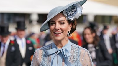 Kate Middleton's pastel blue peplum dress features the most incredible turquoise stone neckline, said to help enhance communication and expression
