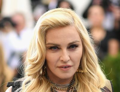 Madonna postpones world tour after going into intensive care