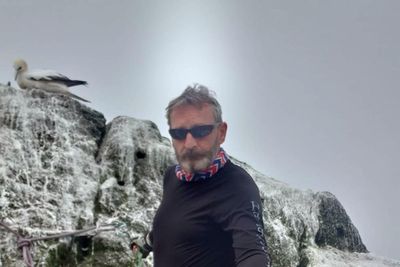 Dramatic rescue for man bidding to beat record for longest stay on remote island