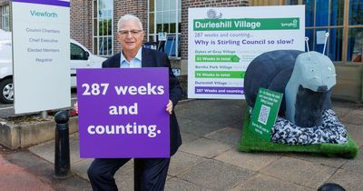 Housing developer stages protest over decision delay at council HQ with giant model snail