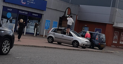 People left baffled as Paisley man strapped chest of drawers and mirror to roof of car to drive home