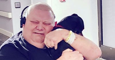 Man bursts into tears after being reunited with dog who ran away while in coma