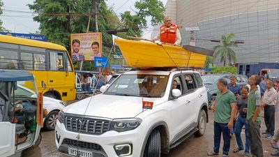 Samajwadi Party MLA sits on boat atop SUV to protest against waterlogging in Kanpur