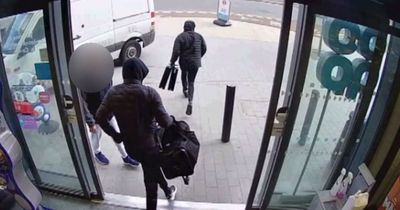 Terrifying moment £260k armed robbery gang caught leaving with huge haul of cash