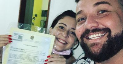 Beaming husband and wife celebrate their divorce TOGETHER as they show off certificate