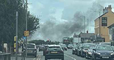 Smoke seen for miles around as emergency crews rush to fire
