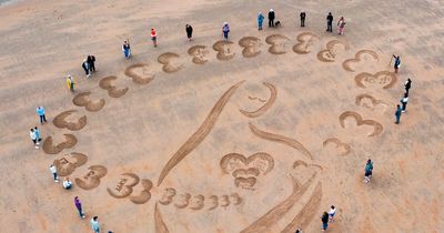 Families reflect on baby loss with poignant sand art tribute on Northumberland beach