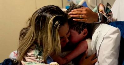 Heartwarming moment a mum hugs her young son after he wakes up after 16 days in a coma