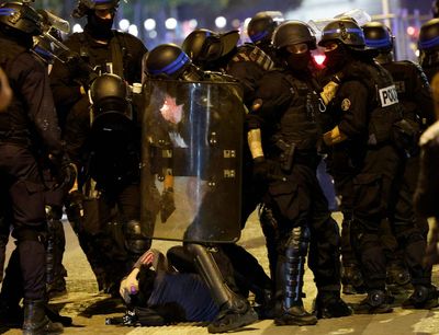 France riots – live: Paris protests ease as family of teen killed in shooting makes desperate plea to rioters