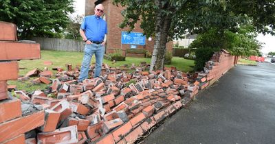 Wall of church completely destroyed after car crashes and flips over