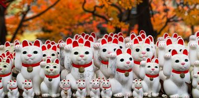 What is the story of maneki-neko, the Japanese beckoning cat?