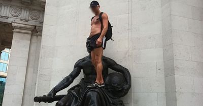 Fury as topless man scales city's war memorial saying he'll come down 'when I'm ready'