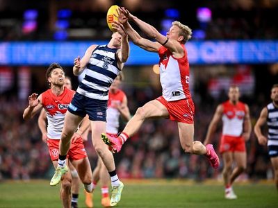 Heeney snatches draw for Swans against Cats
