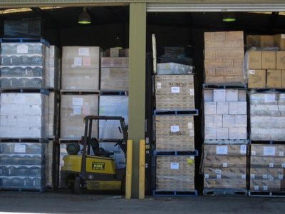 Woolworths worker dies after pallet stack collapses