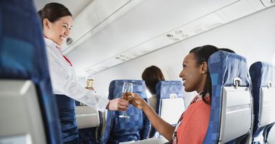 Alcohol expert reveals why you get drunk quicker on a plane - and the risks of onboard drinking