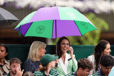 Showers halt play at Wimbledon on Tuesday but better weather to come