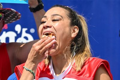 Miki Sudo successfully defends hot dog-eating title; stormy weather delays men's contest