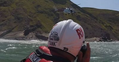 Major rescue after walker trapped 50ft up on 'treacherous' cliff face