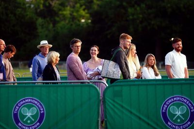 Wimbledon fans hoping for fewer showers after rain-hit second day