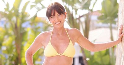 Davina McCall, 55, looks stunning in yellow string bikini as she poses by the pool