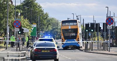 Female cyclist hit by bus as windscreen left shattered and police close main road