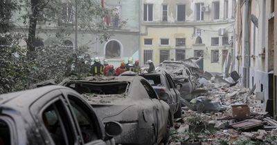 Four dead in Lviv and people trapped in rubble after devastating Russian missile strike