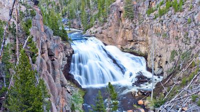 Young child spotted clambering over rocks on brink of Yellowstone waterfall