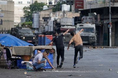 Israeli forces kill 2 Palestinians in shootout in the occupied West Bank